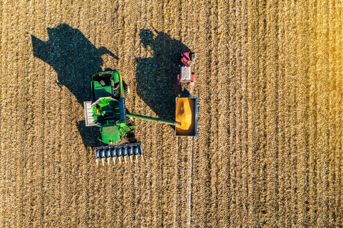 aerial-view-of-harvester-harvesting-corn-in-the-fi-2022-01-18-20-36-42-utc (1)